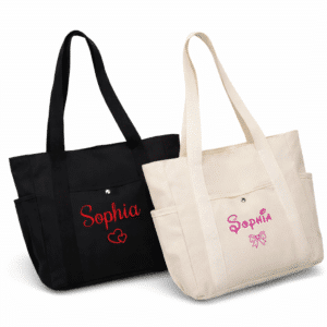 Personalized canvas tote bags with custom names in red and pink lettering on black and beige tote bags with front pockets