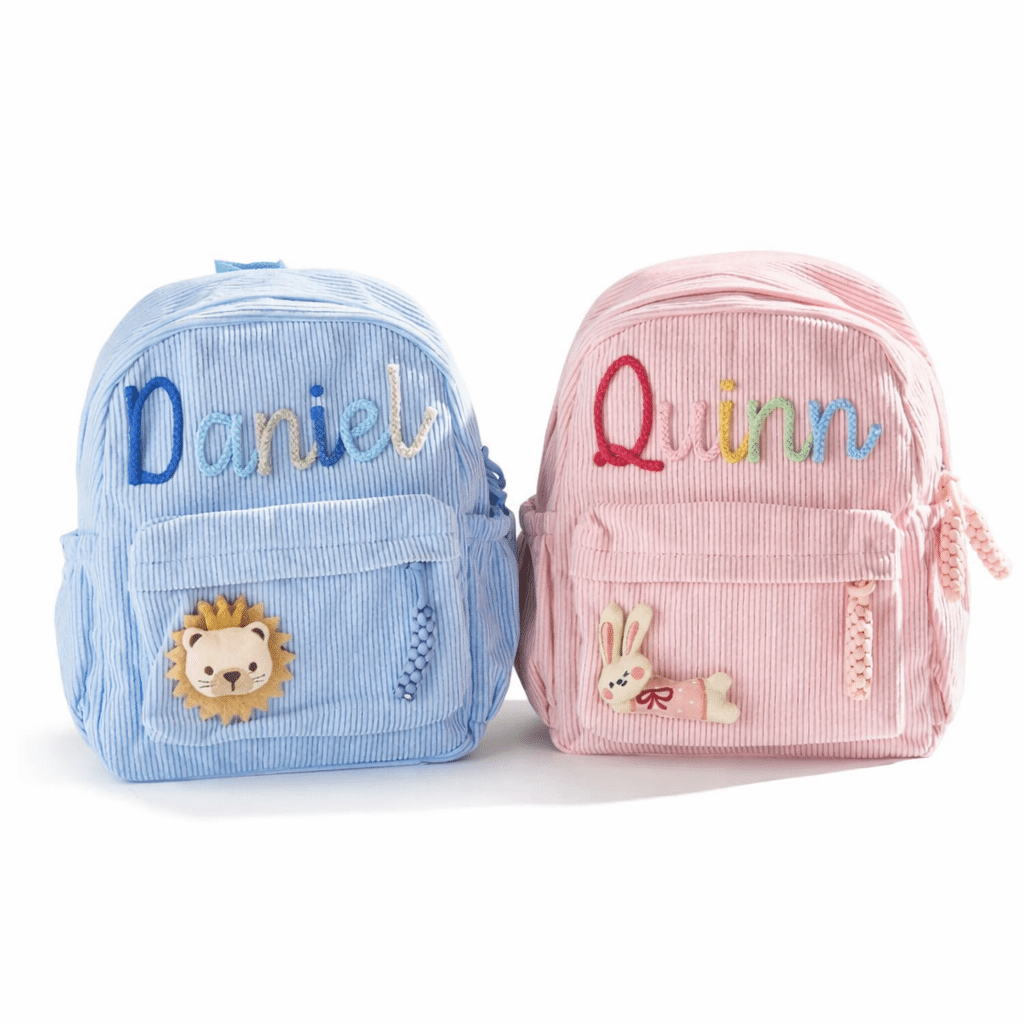 Blue and pink personalised kids backpacks with custom embroidered names, corduroy toddler school bags with cute animal design